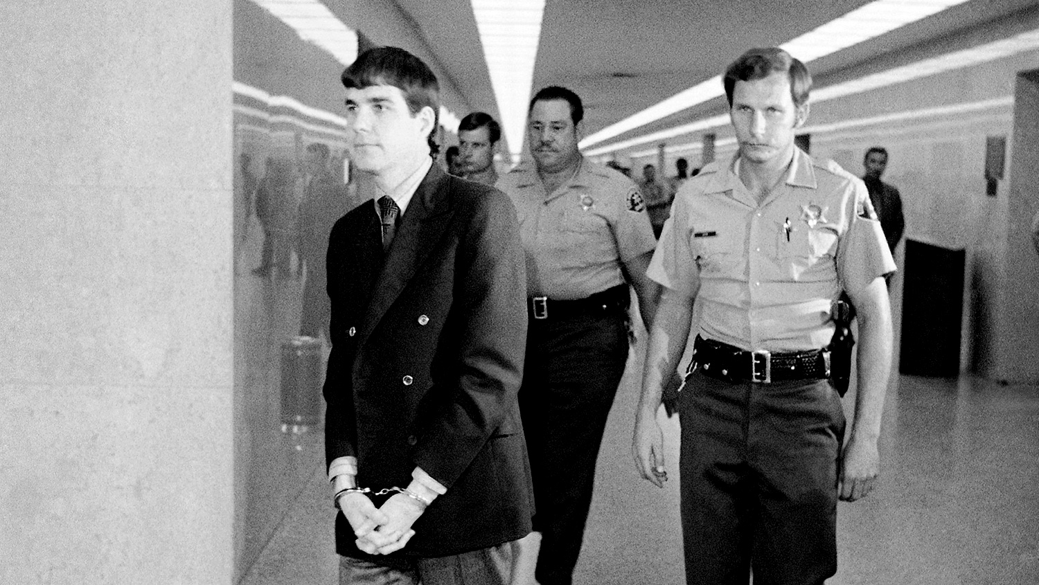Charles 'Tex' Watson is led back to his cell from a courtroom in Los Angeles after he was convicted Tuesday of seven counts ot first-degree murder and one of conspiracy to commit murder in the Tate-LaBianca slayings. Watson, a former member of the Charles Manson 'family' was the last of five defendants to be convicted in the murders.